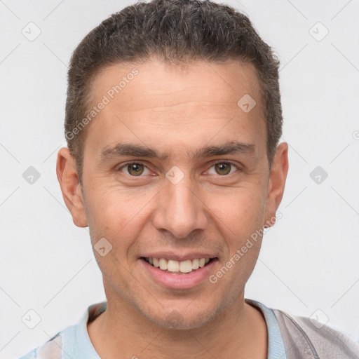 Joyful white adult male with short  brown hair and brown eyes