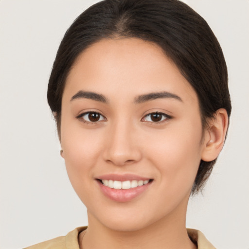 Joyful white young-adult female with medium  brown hair and brown eyes