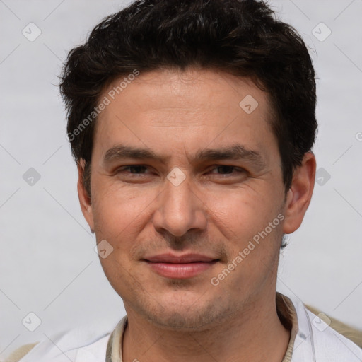 Joyful white adult male with short  brown hair and brown eyes