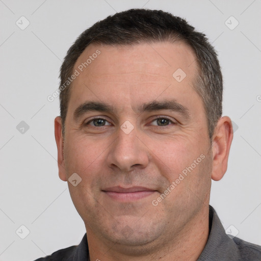 Joyful white adult male with short  brown hair and brown eyes