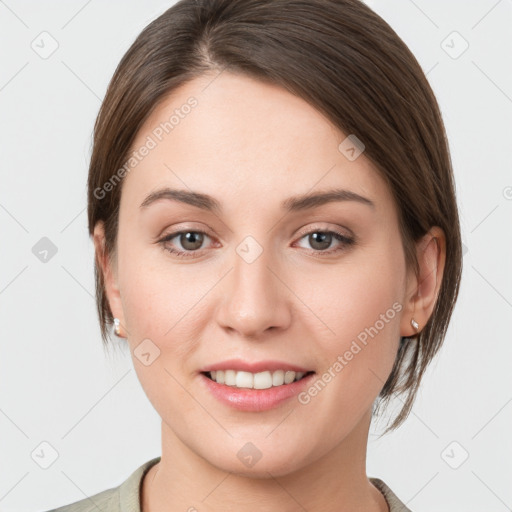 Joyful white young-adult female with medium  brown hair and grey eyes