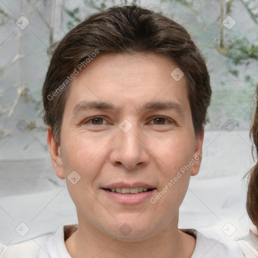 Joyful white adult male with short  brown hair and brown eyes