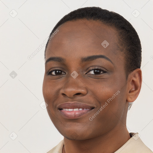 Joyful black young-adult female with short  brown hair and brown eyes