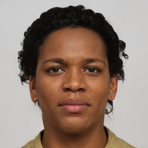 Joyful black young-adult female with short  brown hair and brown eyes