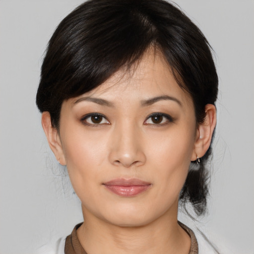 Neutral asian young-adult female with medium  brown hair and brown eyes