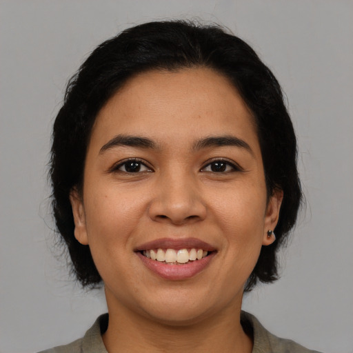 Joyful asian young-adult female with medium  brown hair and brown eyes