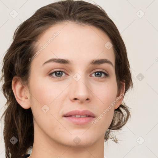 Joyful white young-adult female with medium  brown hair and green eyes