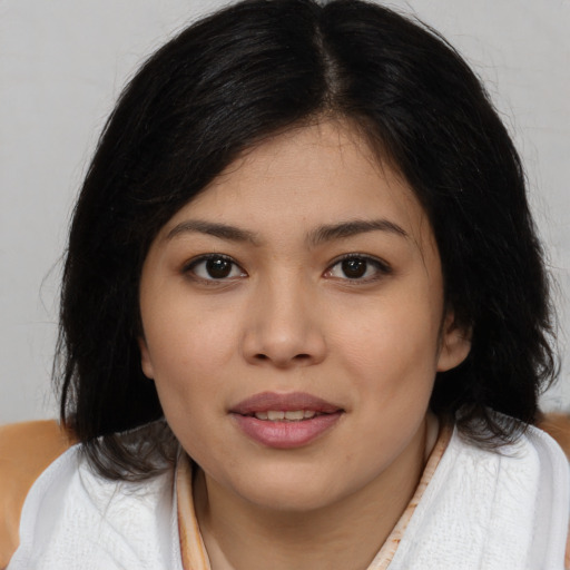 Joyful white young-adult female with medium  black hair and brown eyes
