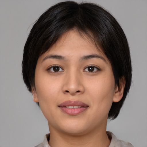 Joyful asian young-adult female with medium  brown hair and brown eyes