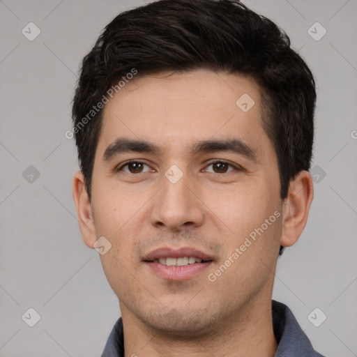 Joyful white young-adult male with short  black hair and brown eyes