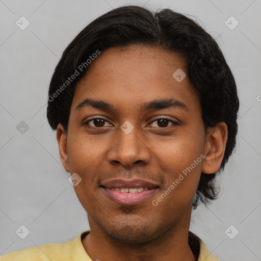 Joyful black young-adult male with short  black hair and brown eyes