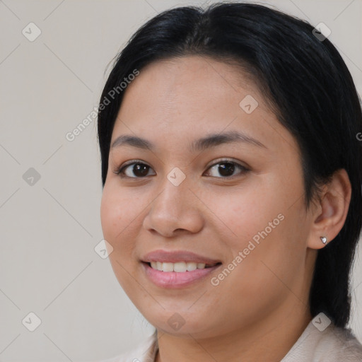 Joyful asian young-adult female with medium  black hair and brown eyes