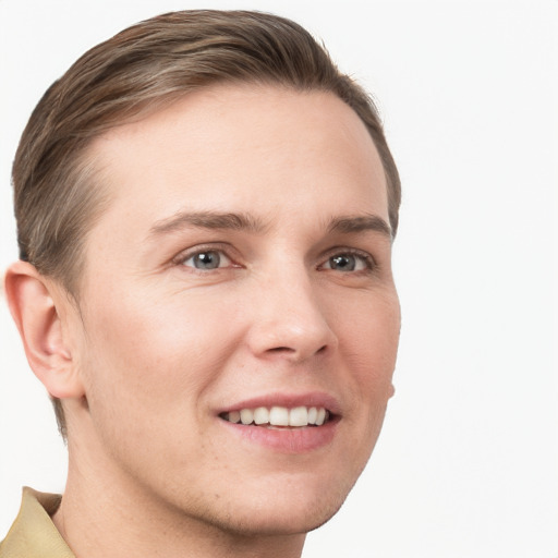 Joyful white young-adult male with short  brown hair and grey eyes