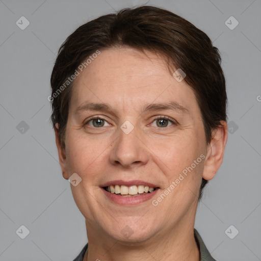 Joyful white adult female with short  brown hair and grey eyes