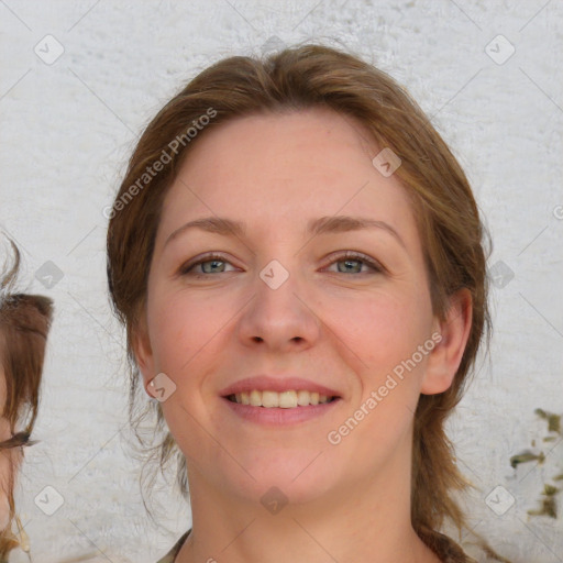 Joyful white young-adult female with medium  brown hair and blue eyes