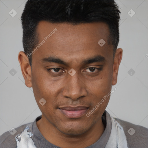 Joyful black young-adult male with short  black hair and brown eyes