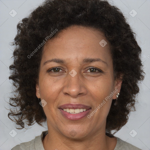 Joyful black adult female with medium  brown hair and brown eyes