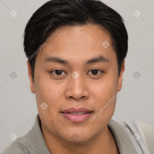 Joyful asian young-adult male with short  brown hair and brown eyes