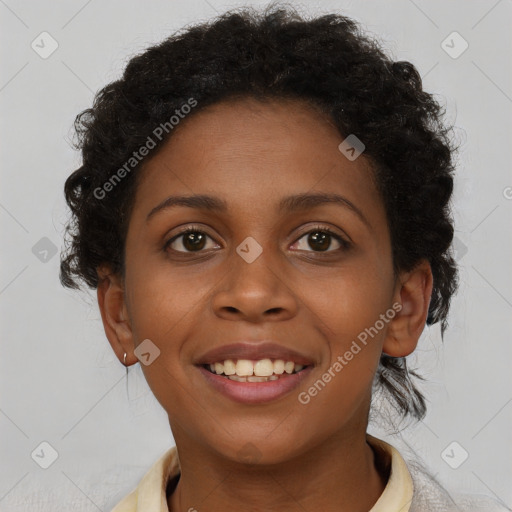 Joyful black young-adult female with short  brown hair and brown eyes