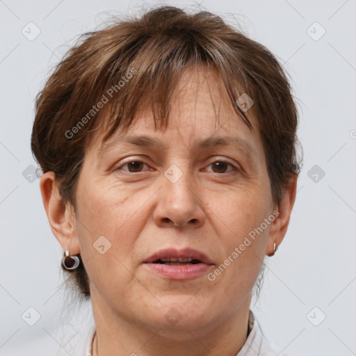 Joyful white adult female with short  brown hair and brown eyes