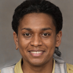 Joyful latino young-adult male with short  brown hair and brown eyes