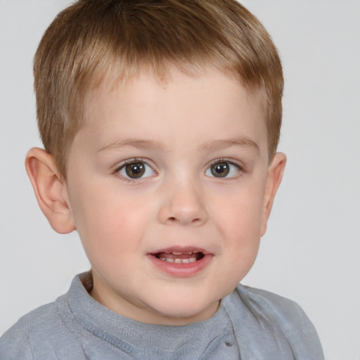 Joyful white child male with short  brown hair and brown eyes