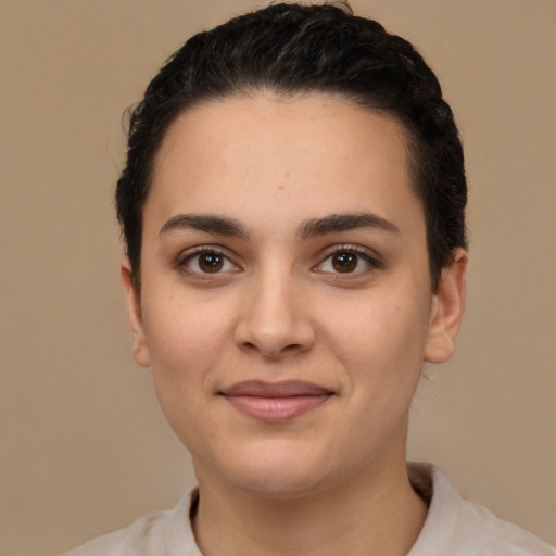 Joyful white young-adult female with short  brown hair and brown eyes