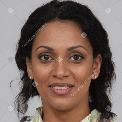 Joyful black adult female with medium  brown hair and brown eyes