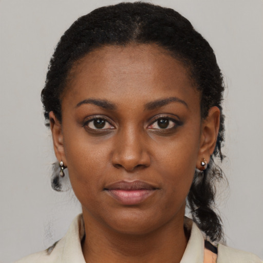 Neutral black young-adult female with medium  black hair and brown eyes