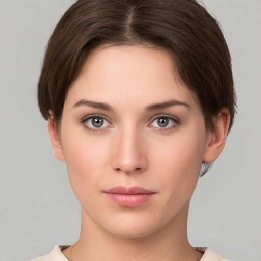 Neutral white young-adult female with short  brown hair and brown eyes