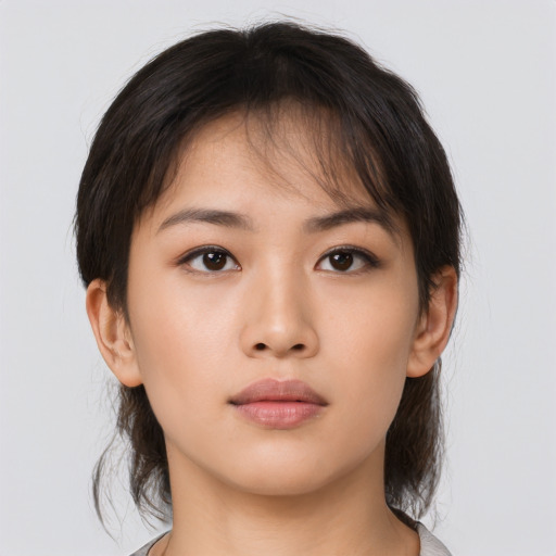 Neutral asian young-adult female with medium  brown hair and brown eyes