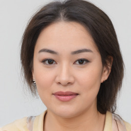 Joyful white young-adult female with medium  brown hair and brown eyes