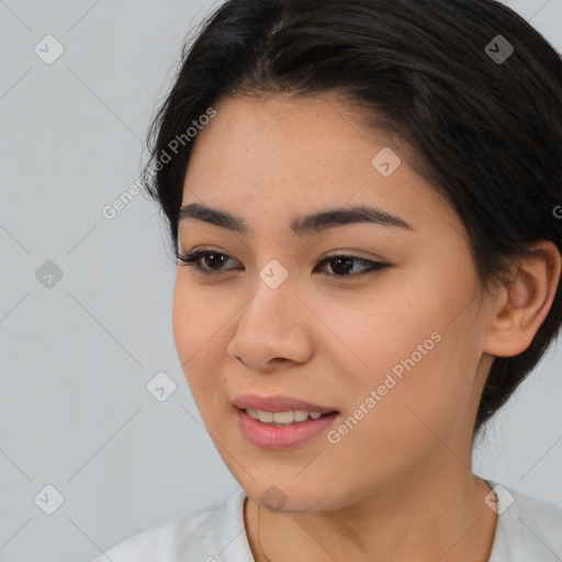 Joyful asian young-adult female with short  brown hair and brown eyes