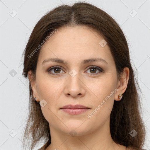 Joyful white young-adult female with long  brown hair and grey eyes