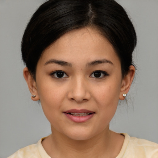 Joyful white young-adult female with medium  brown hair and brown eyes