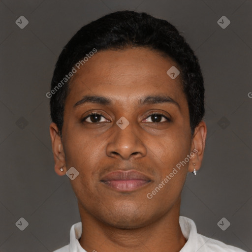 Joyful black young-adult male with short  black hair and brown eyes