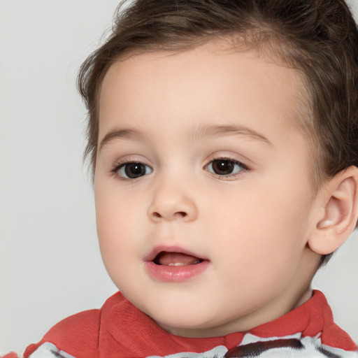 Joyful white child female with short  brown hair and brown eyes