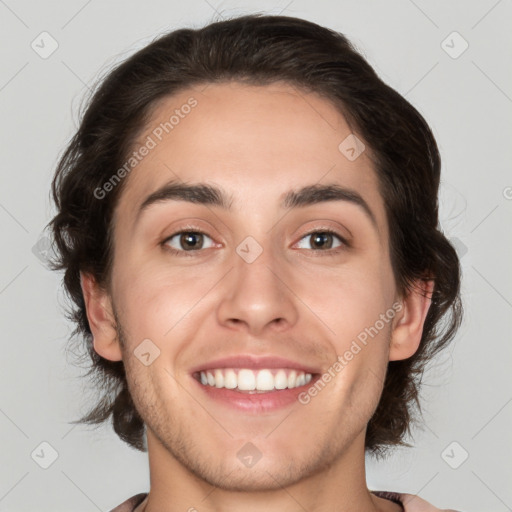 Joyful white young-adult male with medium  brown hair and brown eyes