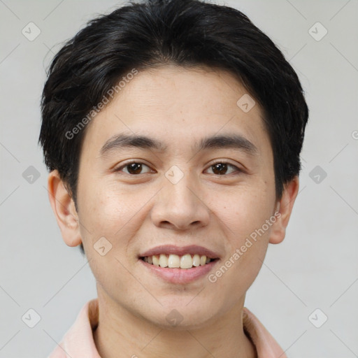 Joyful asian young-adult male with short  brown hair and brown eyes