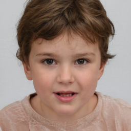 Joyful white child female with short  brown hair and brown eyes