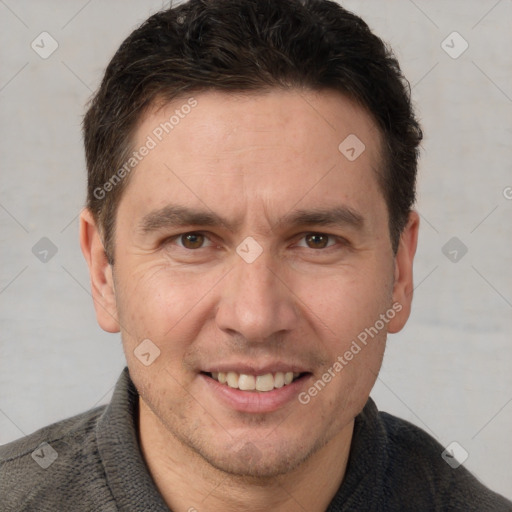 Joyful white adult male with short  brown hair and brown eyes