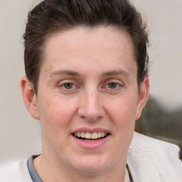 Joyful white adult female with short  brown hair and grey eyes