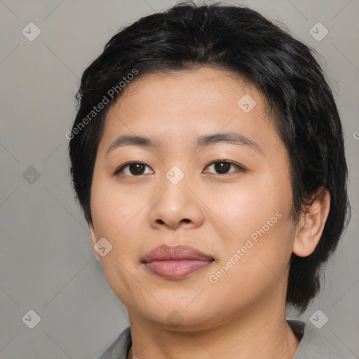 Joyful asian young-adult female with medium  black hair and brown eyes