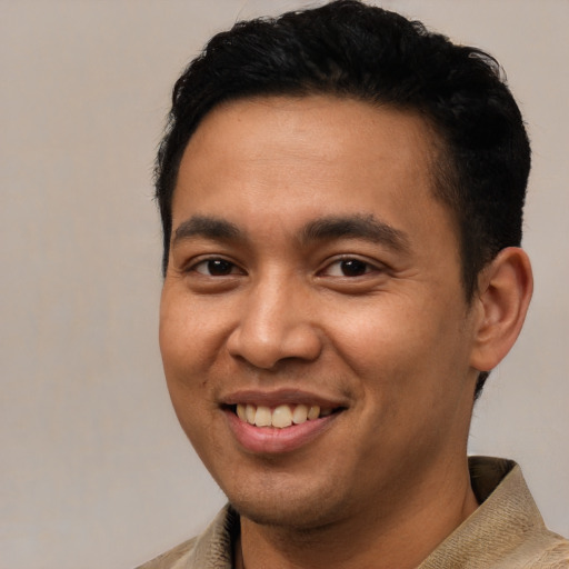 Joyful asian young-adult male with short  black hair and brown eyes