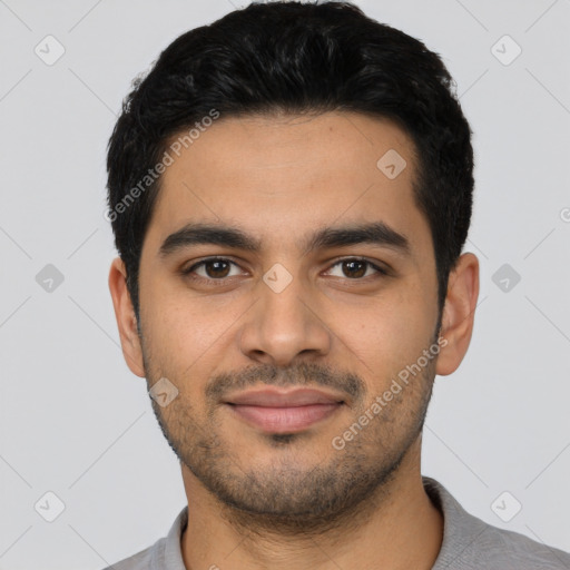 Joyful latino young-adult male with short  black hair and brown eyes