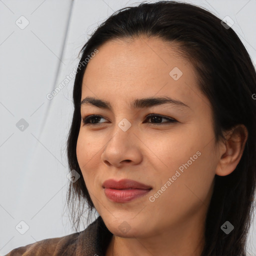 Joyful asian young-adult female with long  black hair and brown eyes