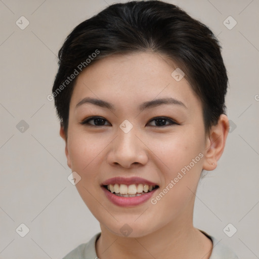 Joyful asian young-adult female with short  brown hair and brown eyes