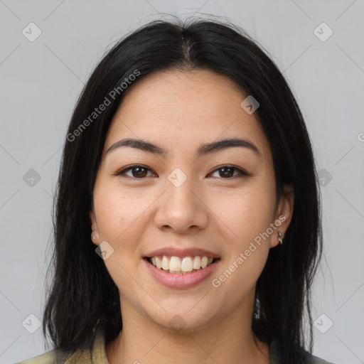 Joyful latino young-adult female with medium  brown hair and brown eyes