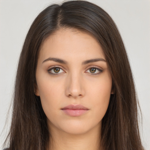 Neutral white young-adult female with long  brown hair and brown eyes
