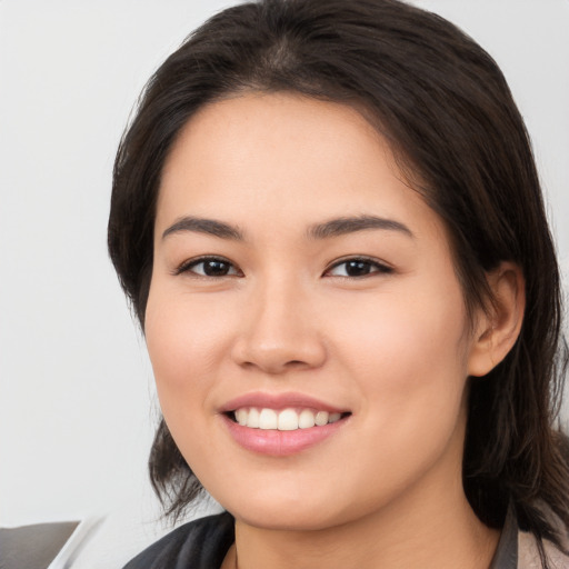 Joyful white young-adult female with medium  brown hair and brown eyes